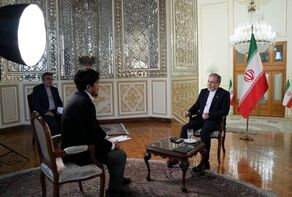 Foreign minister says Iran is determined to continue its peaceful nuclear program